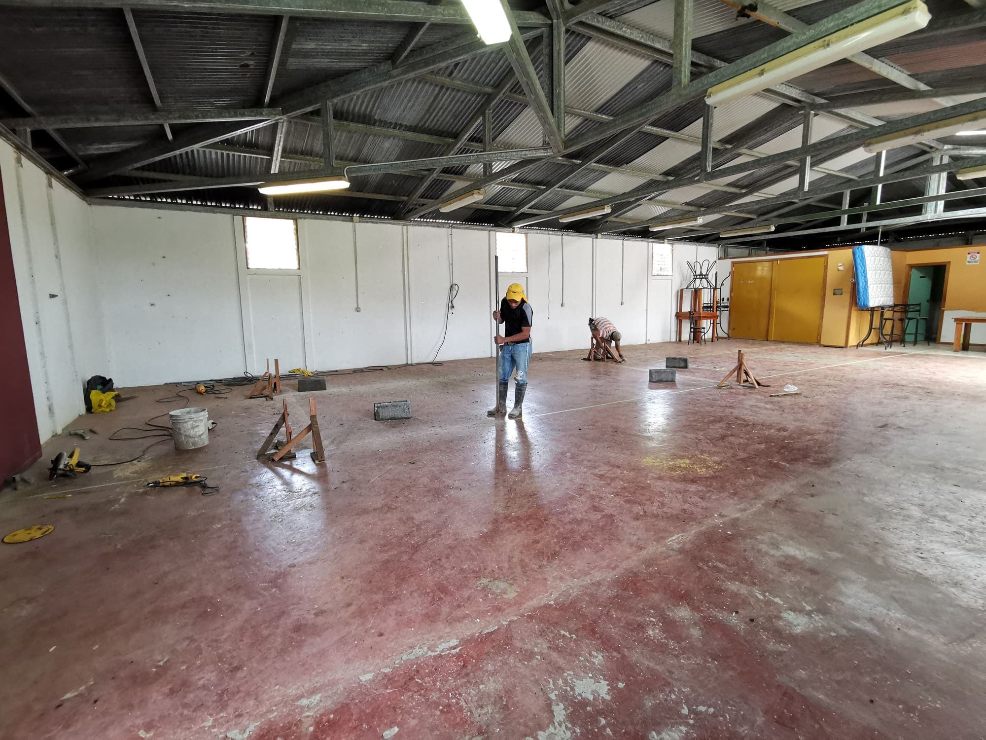 The empty shed inside, its floor freshly stained