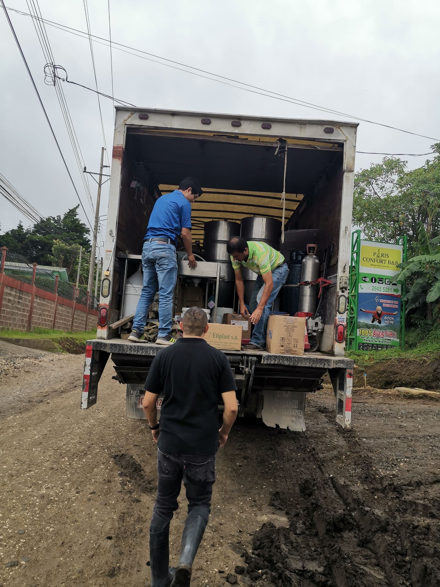 Unloading equipment from a truck on the muddy track