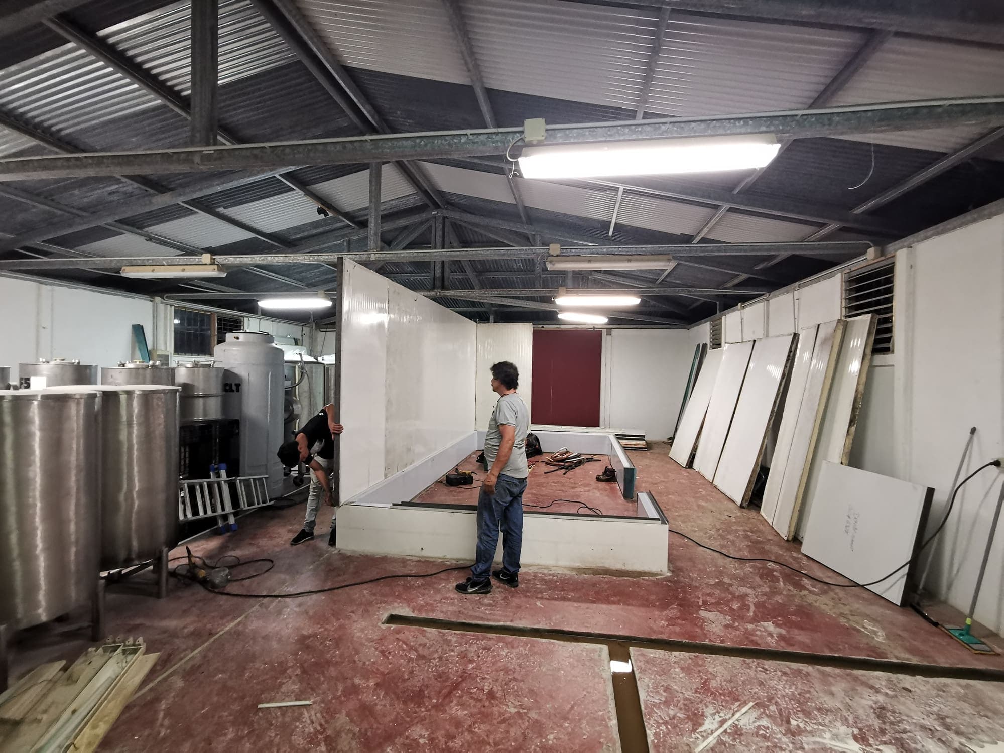 The shed with the tanks at the far end, the floor still unfinished