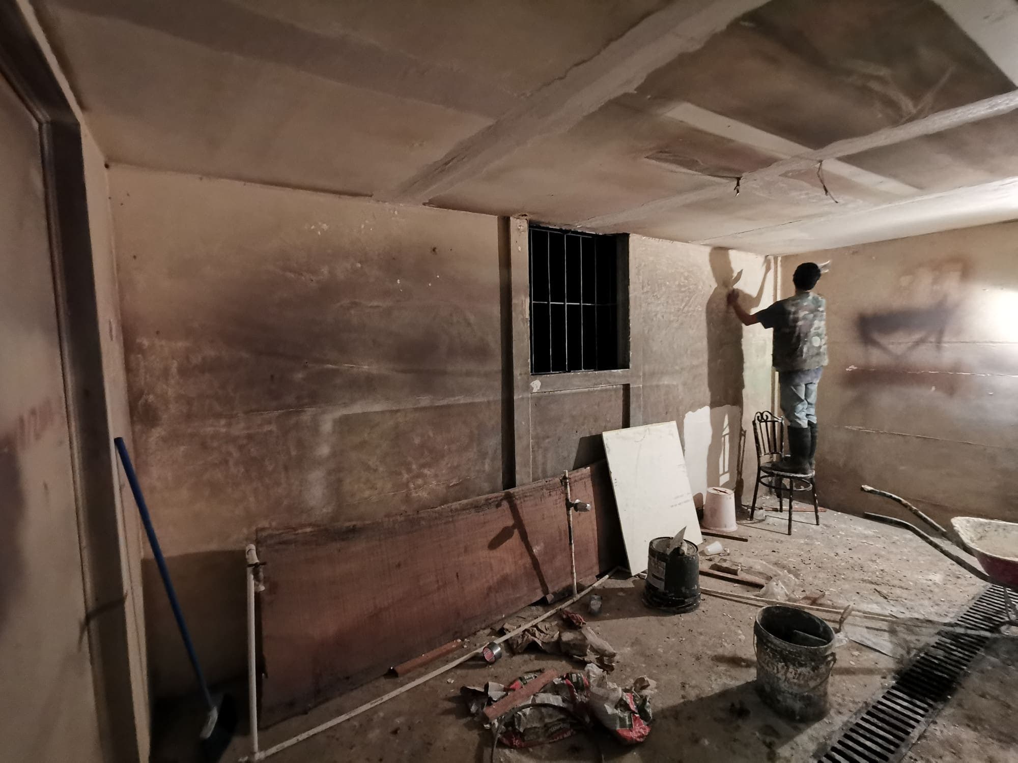 Plastering the walls of one of the rooms