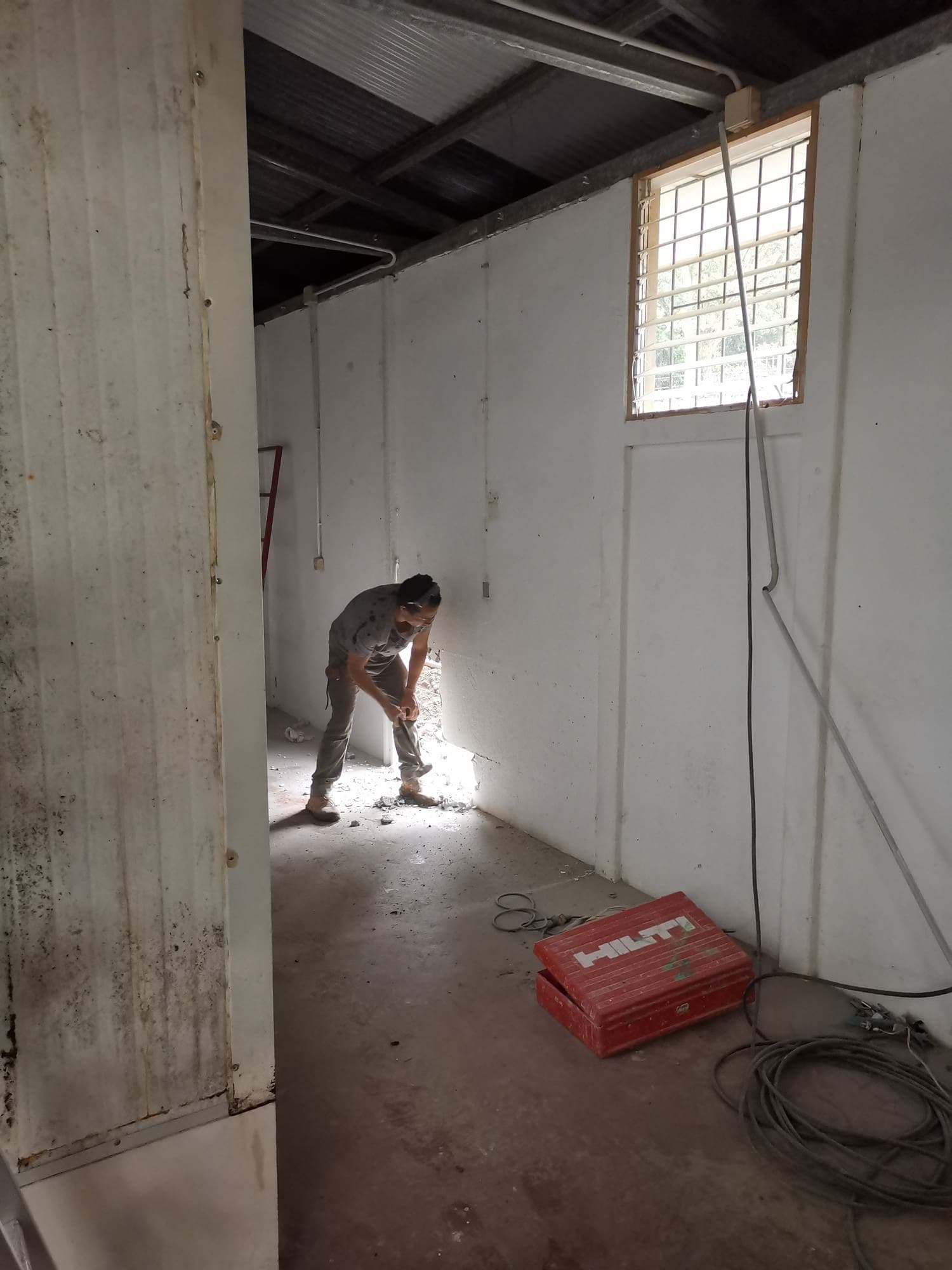 Clearing the bare room before the finishes go in