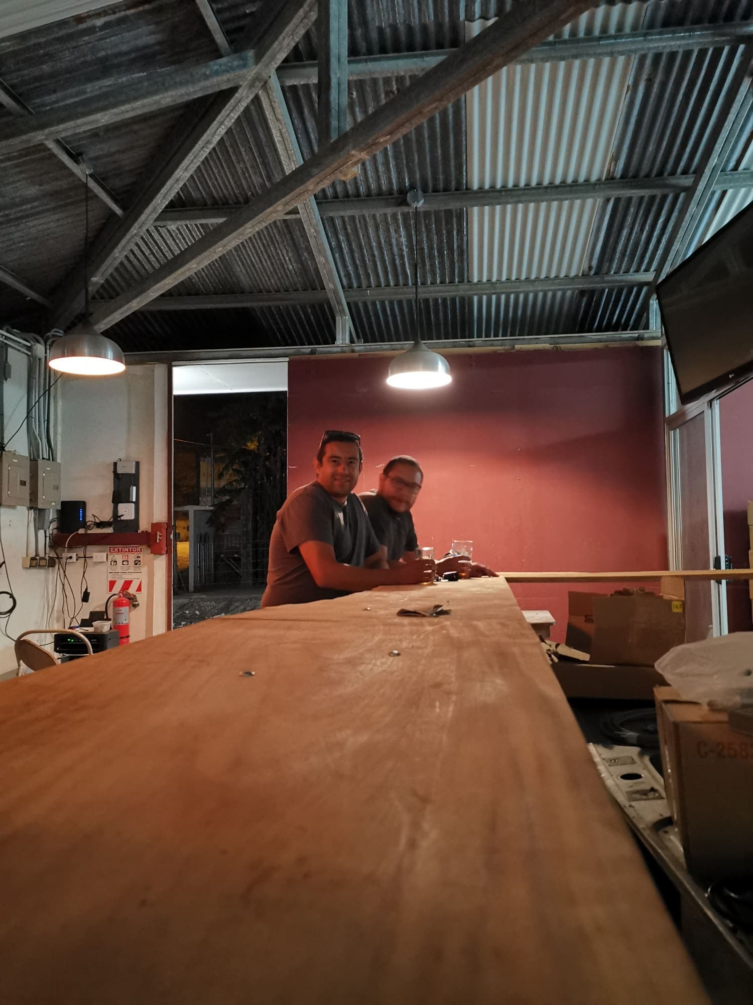 Building the bar counter against the red wall