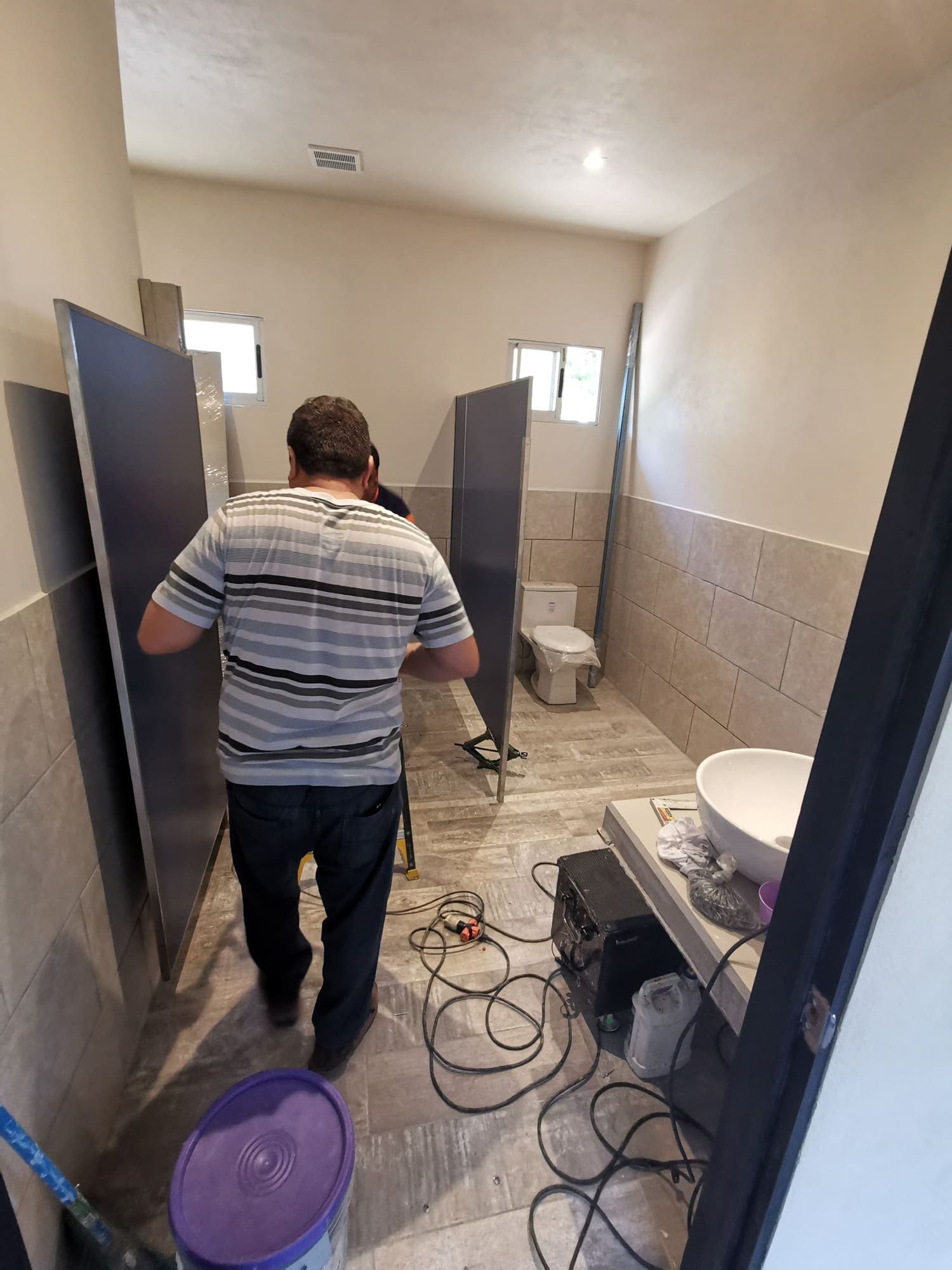 Finishing one of the brewpub's bathrooms