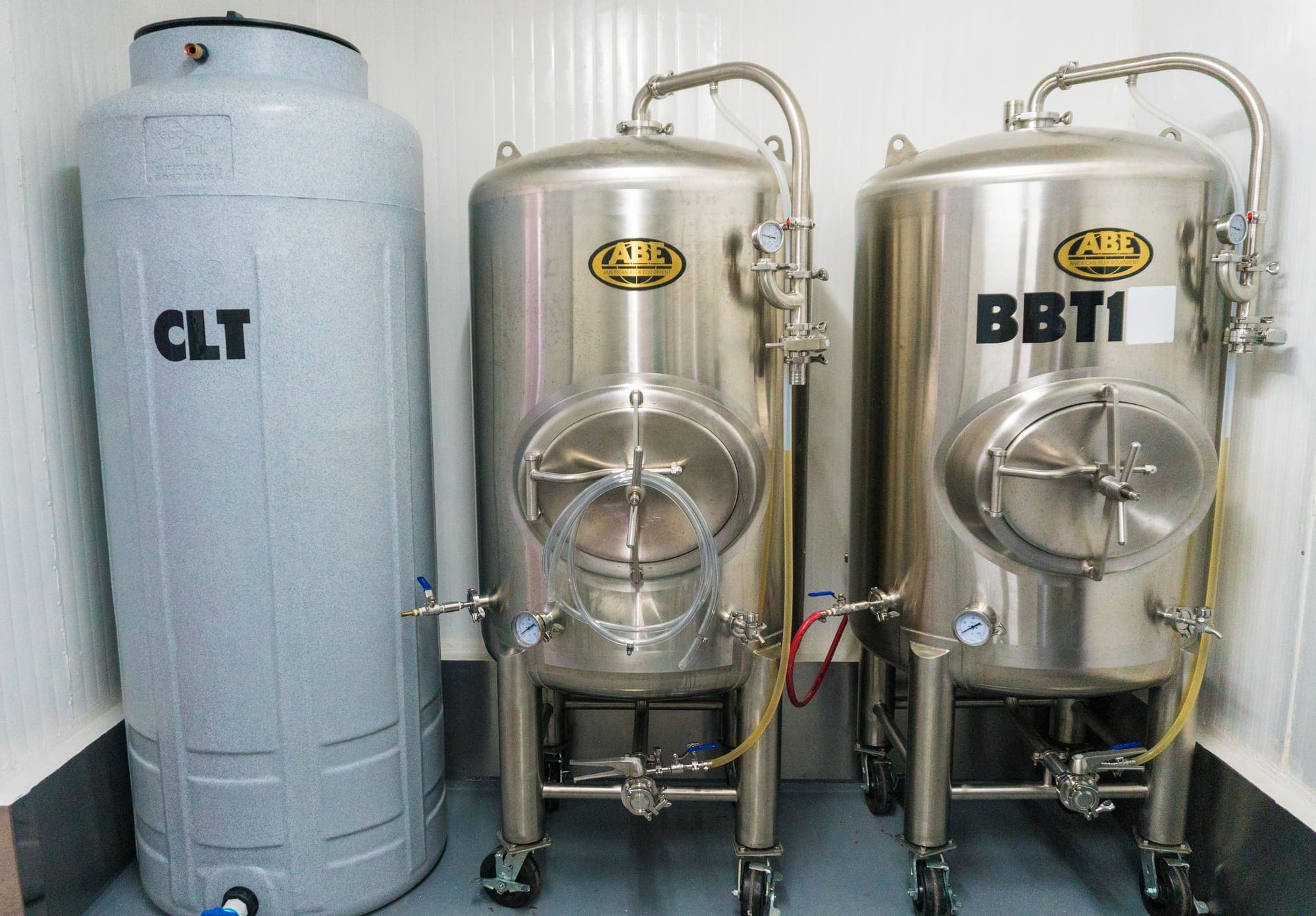 Two bright beer tanks beside the cold liquor tank