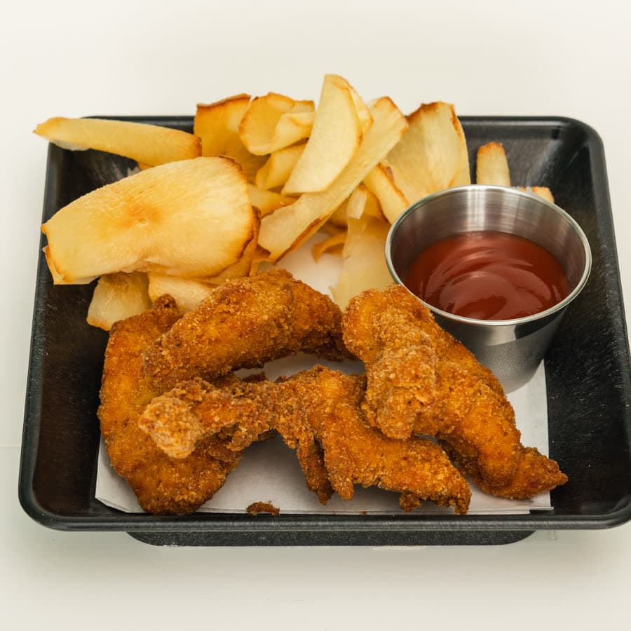 Breaded chicken fingers with potato wedges and ketchup