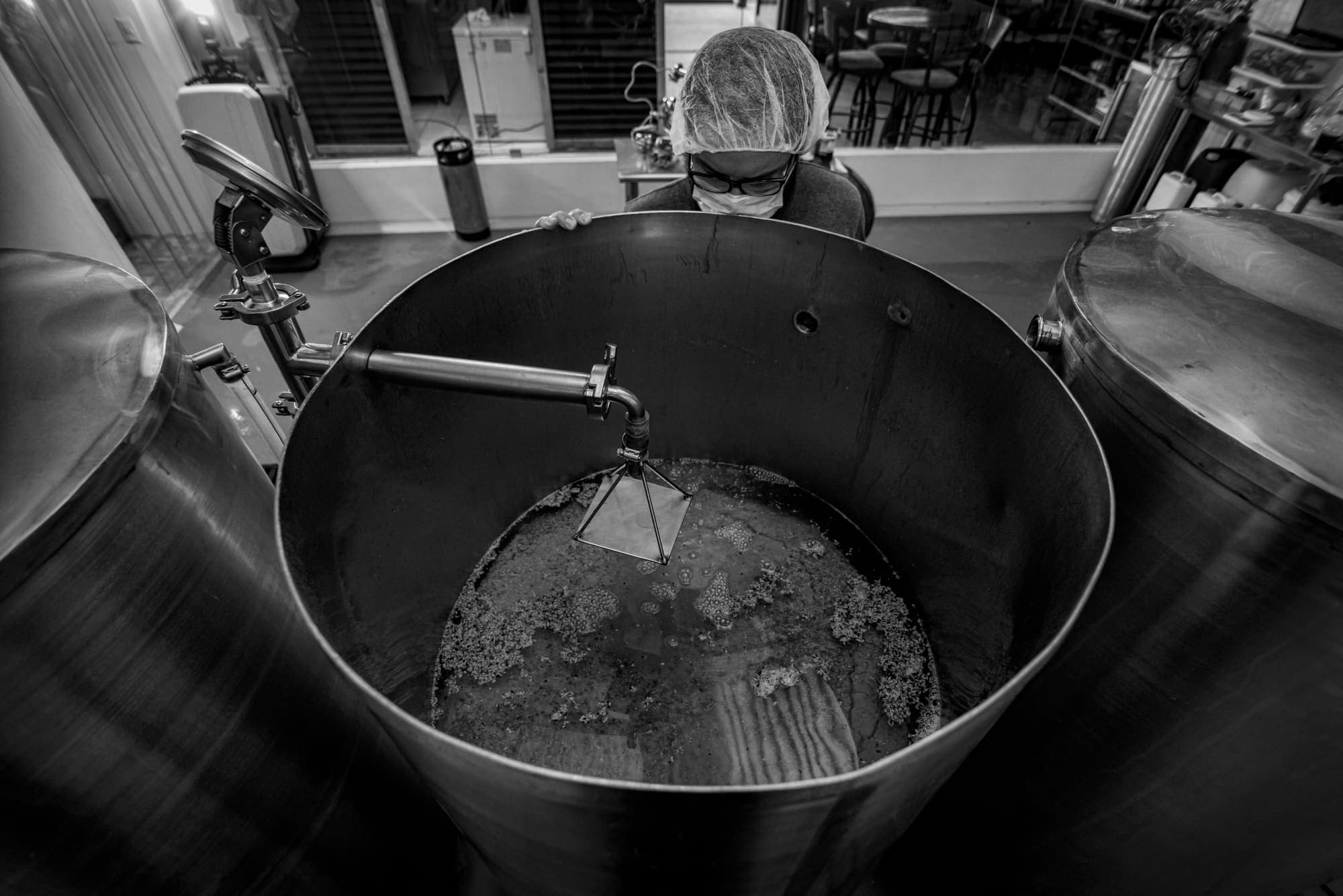 The grain bed at the bottom of the kettle, the brewer looking in from behind