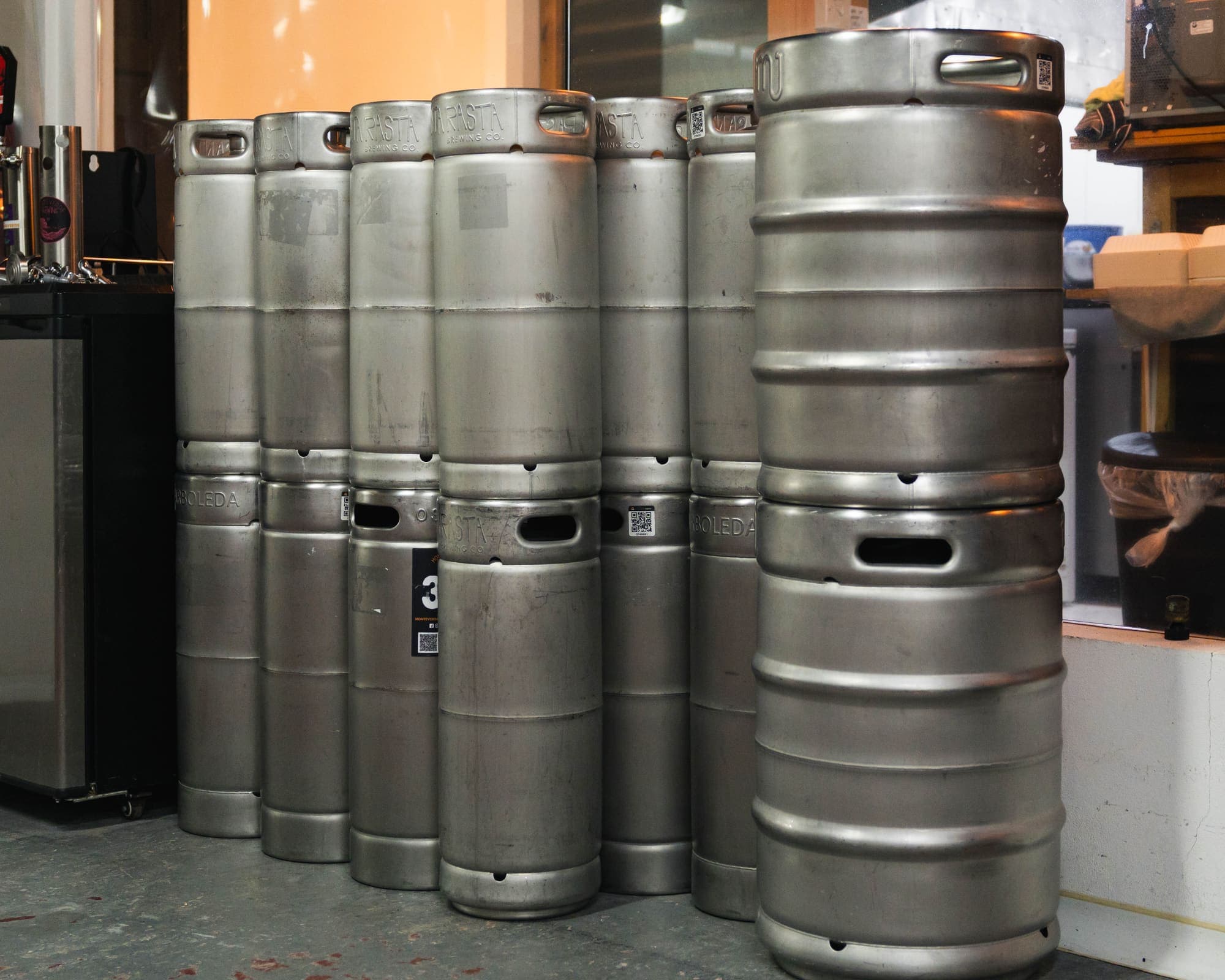 Stacked steel kegs, ready to be filled