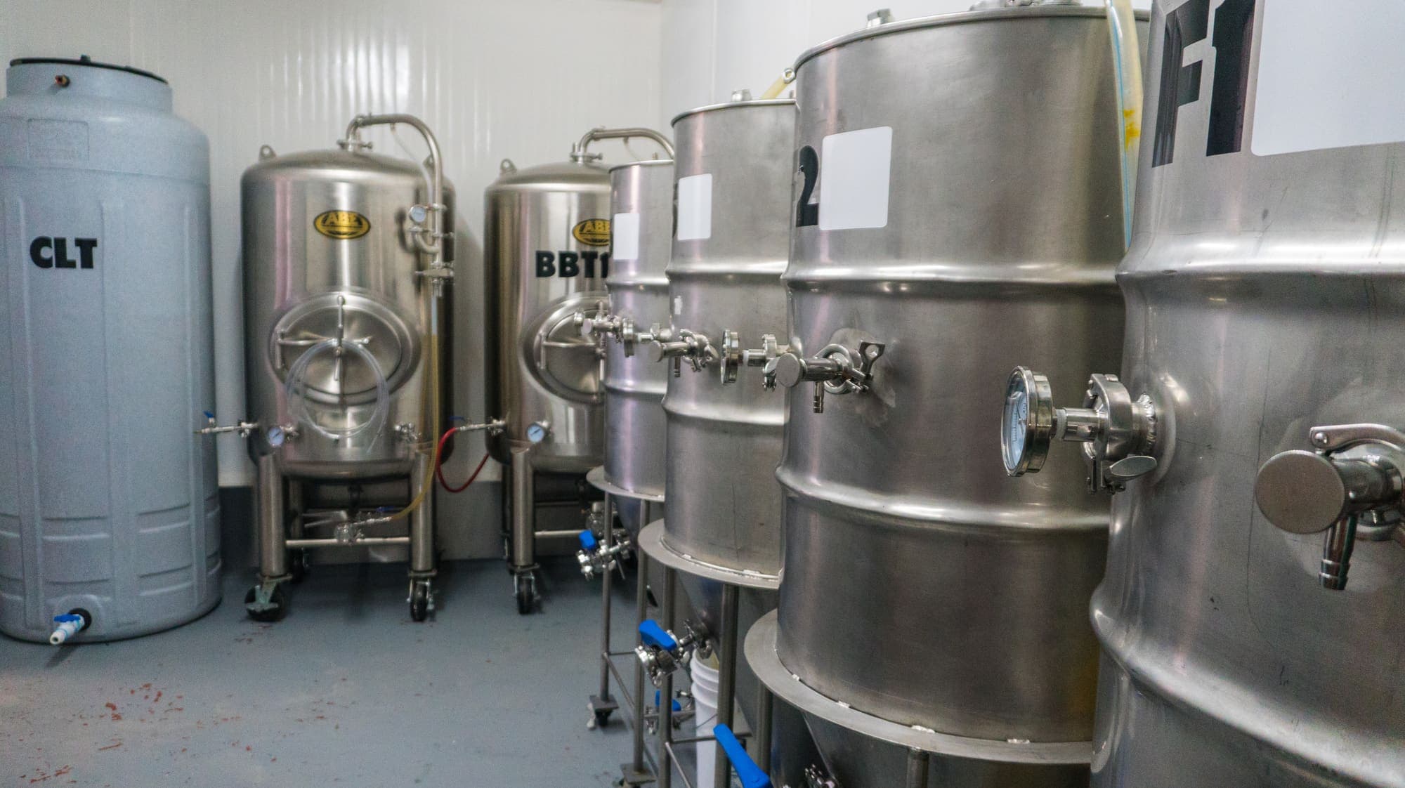 A row of steel tanks in the brewery